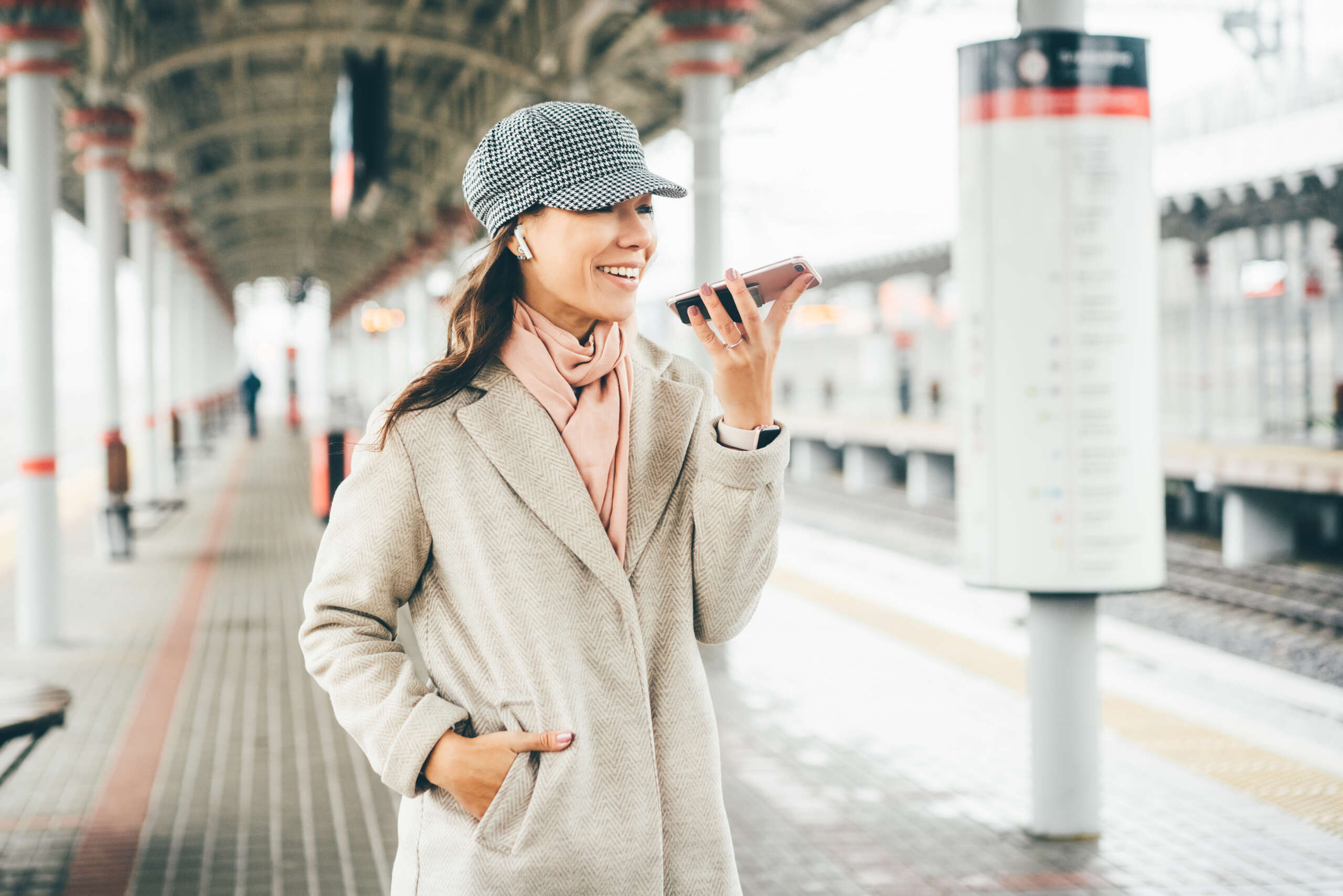 young-woman-in-winter-coat-and-hats-with-phone-in-2025-01-09-04-34-10-utc